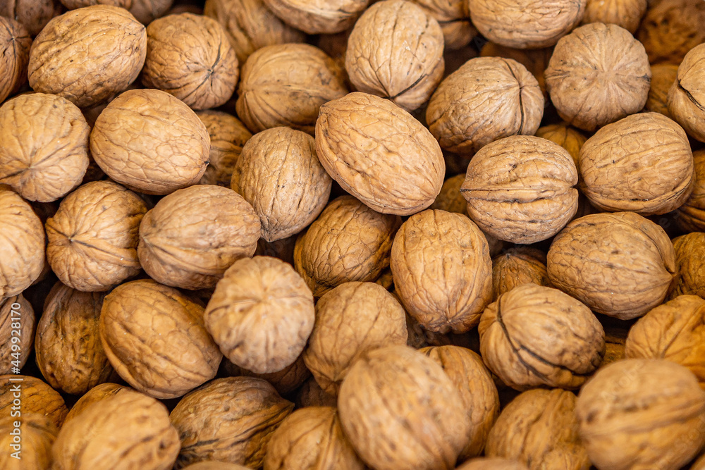 Healthy food-Inshell walnuts are sold at the food market. Natural walnut, background, pattern, texture. A fresh crop of nuts. The concept of healthy eating. Healthy food-Inshell walnuts are sold at the food market. Natural walnut, background, pattern, texture. A fresh crop of nuts. The concept of healthy eating.
