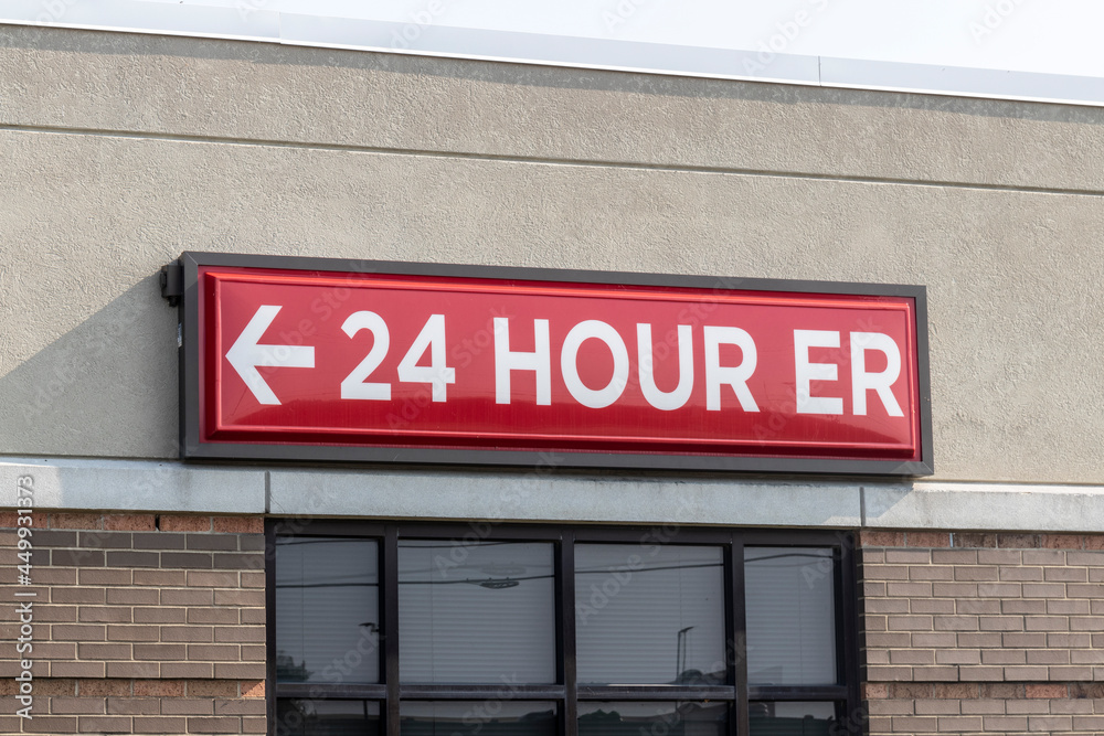 Emergency Entrance Sign for a Local Hospital in alert red. Emergency Entrance Sign for a Local Hospital in alert red.