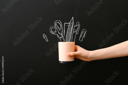 Woman with holder and stati...