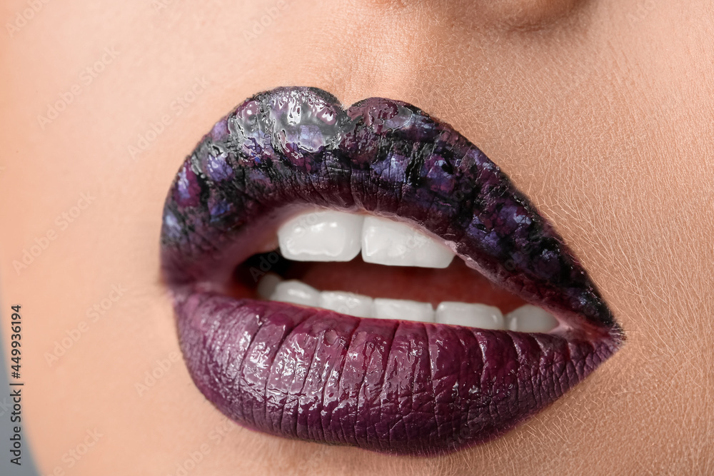 Fototapeta premium Beautiful young woman with unusual makeup, closeup