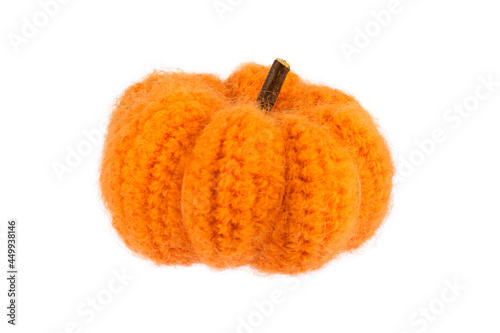 Knitted pumpkin on white background
