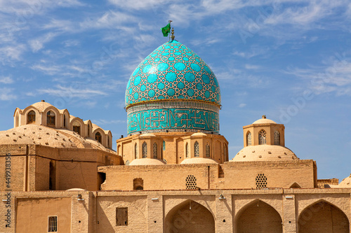 Mosque of  Shah Nematollah Vali Shrine with its green dome in the city of Mahan, Iran