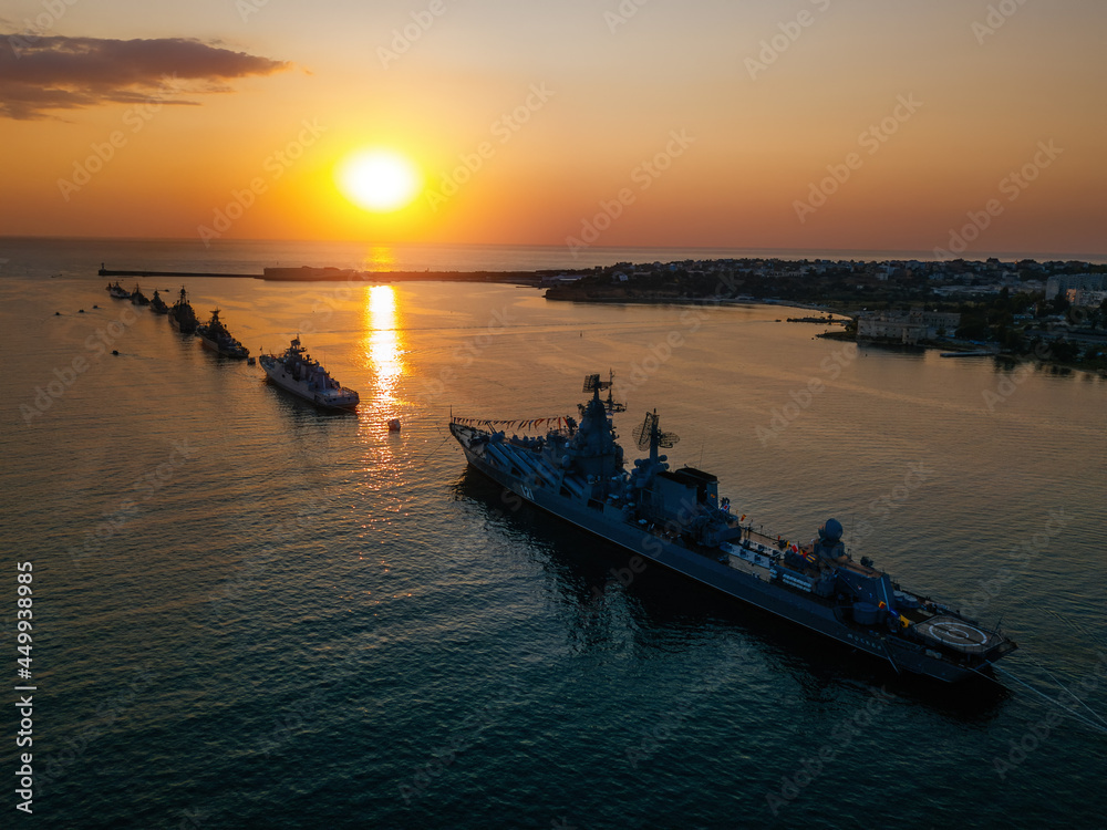 Russian fleet parade in Sevastopol bay at Navy day at the sunset, aerial view