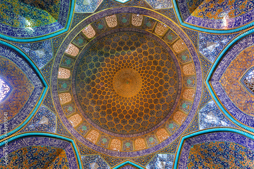 Dome of Sheikh Loftollah Mosque covered with glazed tiles in Isfahan, Iran photo
