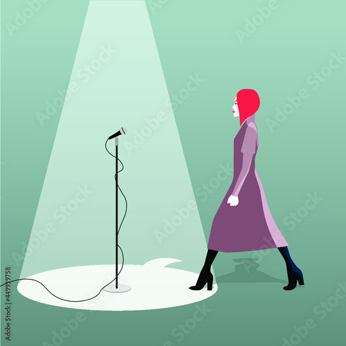 redheaded woman earning voice on a microphone illuminated by spot light