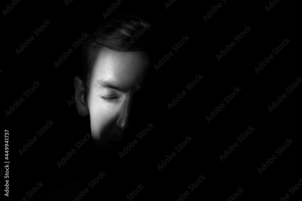 dramatic portrait of a man on black background dramatic portrait of a man on black background