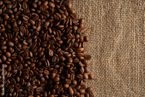 coffee beans scattered on burlap bag