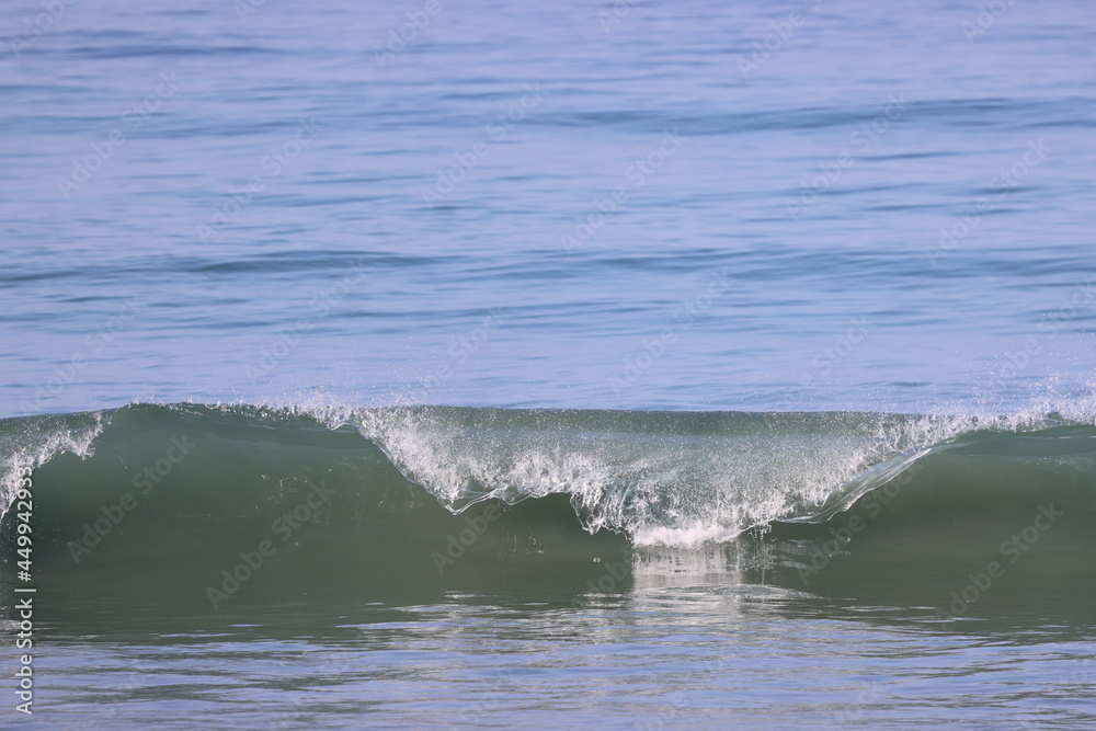 wave breaking on the beach.waves on the beach wave breaking on the beach.waves on the beach