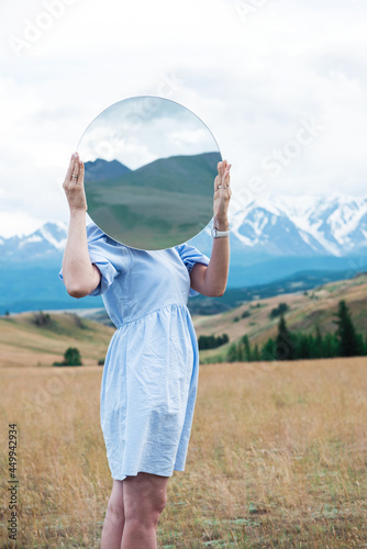 Woman in blue dress in summ...