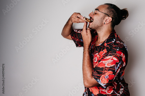 male model eating chocolate pizza photo