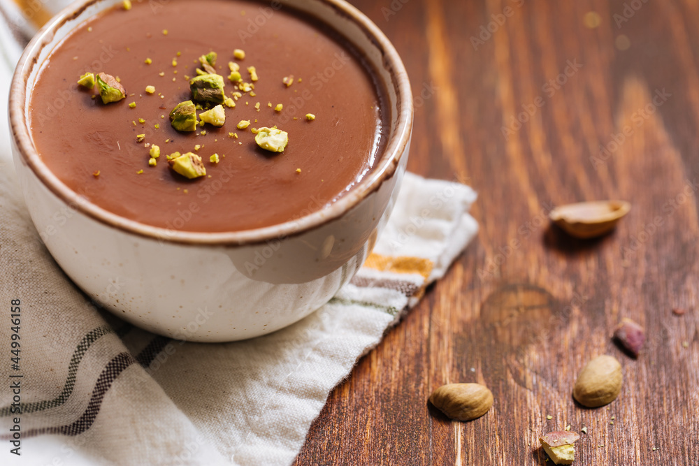 Chocolate pudding with pistachio crumbs on top Chocolate pudding with pistachio crumbs on top