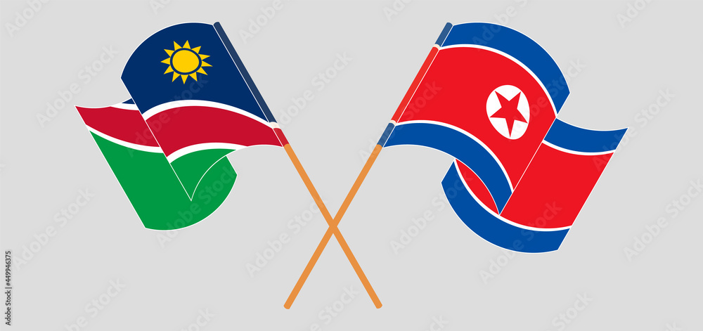 Crossed and waving flags of Namibia and North Korea