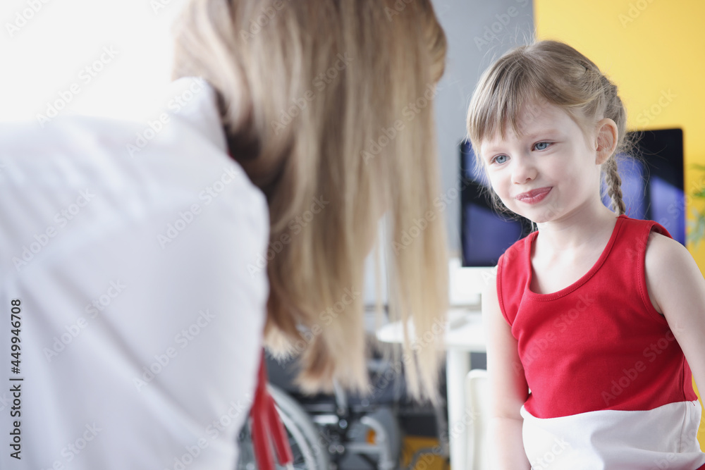 Little beautiful girl communicates with woman doctor Little beautiful girl communicates with woman doctor