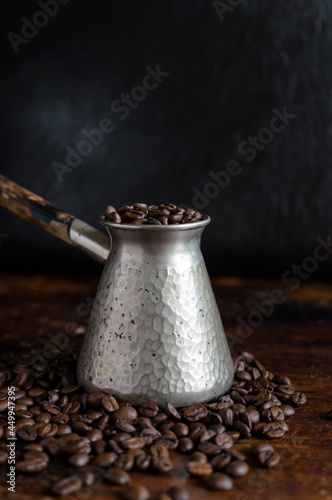 Turkish Jezve Coffee Pot with hot coffee at coffee beans background hd
