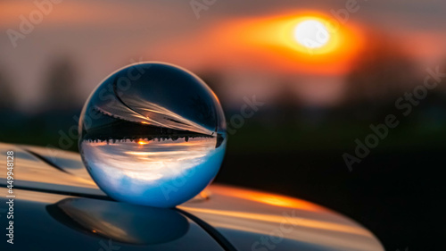 Crystal ball landscape shot with reflections on a car roof at Ganacker, Bavaria, Germany © Martin Erdniss
