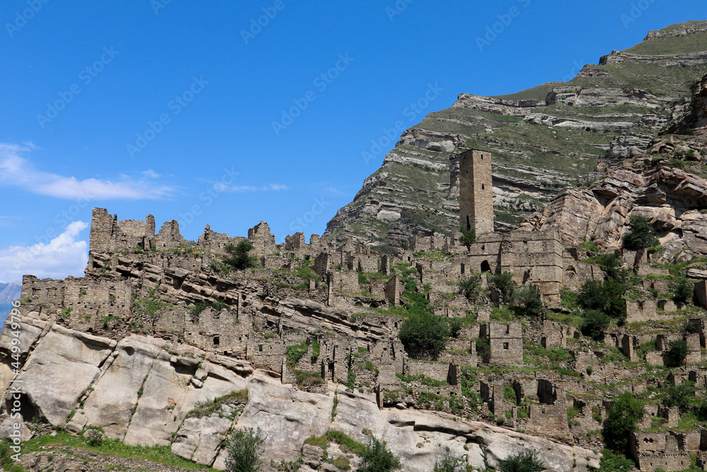 ruins of the ancient village old Kahib in Dagestan, Russia with mountain on the background