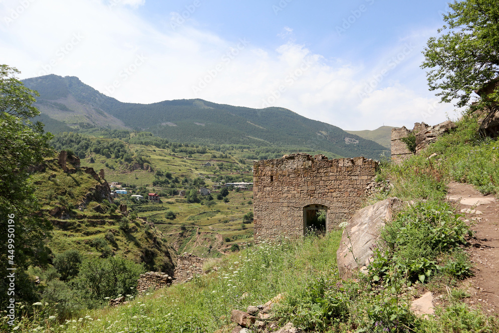old abandoned ancient village Kahib in Dagestan caucasus mountains with new town on the background