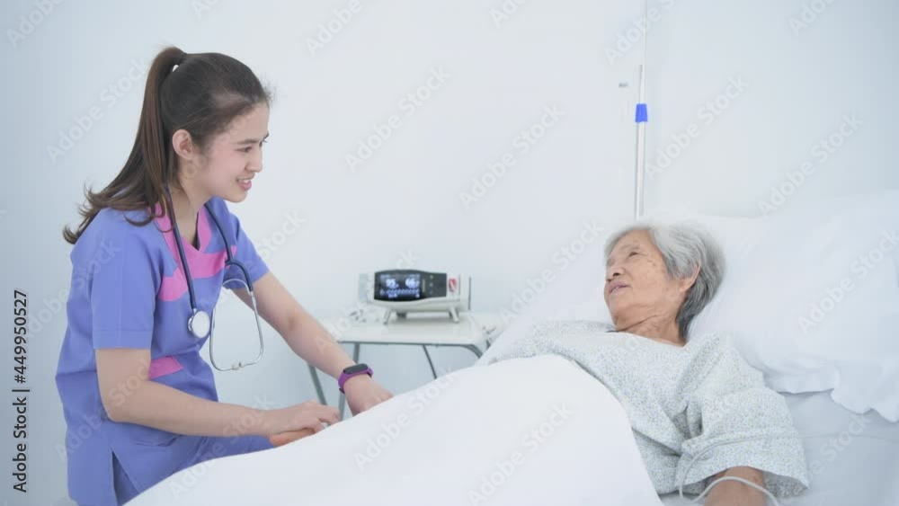Medical concept of 4k Resolution. The doctor is checking the patient's condition in the hospital room. Medical concept of 4k Resolution. The doctor is checking the patient's condition in the hospital room.