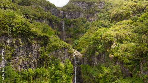 Spectacular double waterfall running through forest at Risco. photo