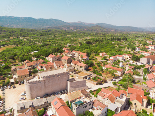 View of the bay and old city with fortress and church in the town of Vrboska on Hvar island, Croatia