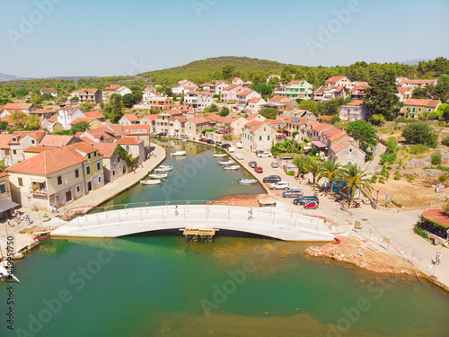 View of the bay and old city with fortress and church in the town of Vrboska on Hvar island, Croatia