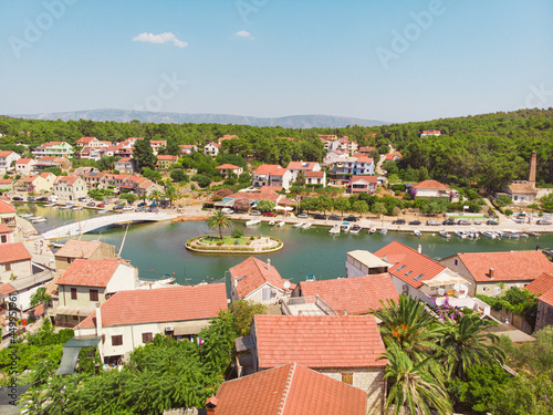 View of the bay and old city with fortress and church in the town of Vrboska on Hvar island, Croatia