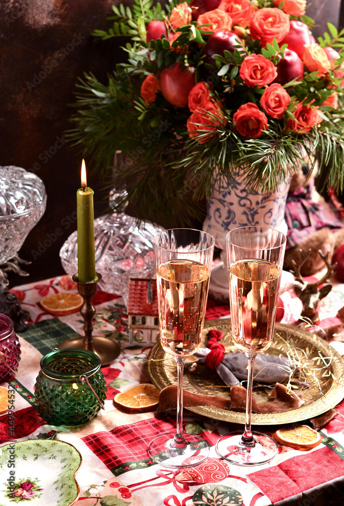 Christmas picture with champagne and a composition on the table