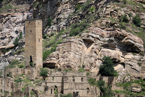 stone battle avar tower and ruins of ancient abandoned village old Kahib in Dagestan, Russia photo