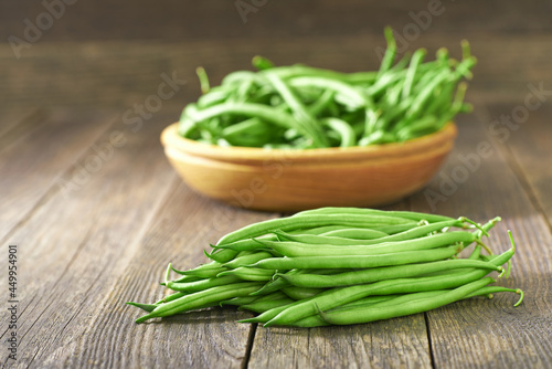 fresh green beans on a wooden table, selective focus.