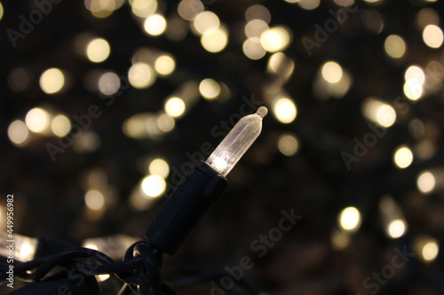 Close up of Mini Christmas Light against background of blurred lights