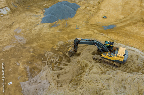 The work with under construction on excavators equipment in the production of earthworks