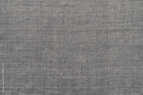 Natural gray linen background or texture, top view, close-up, horizontal