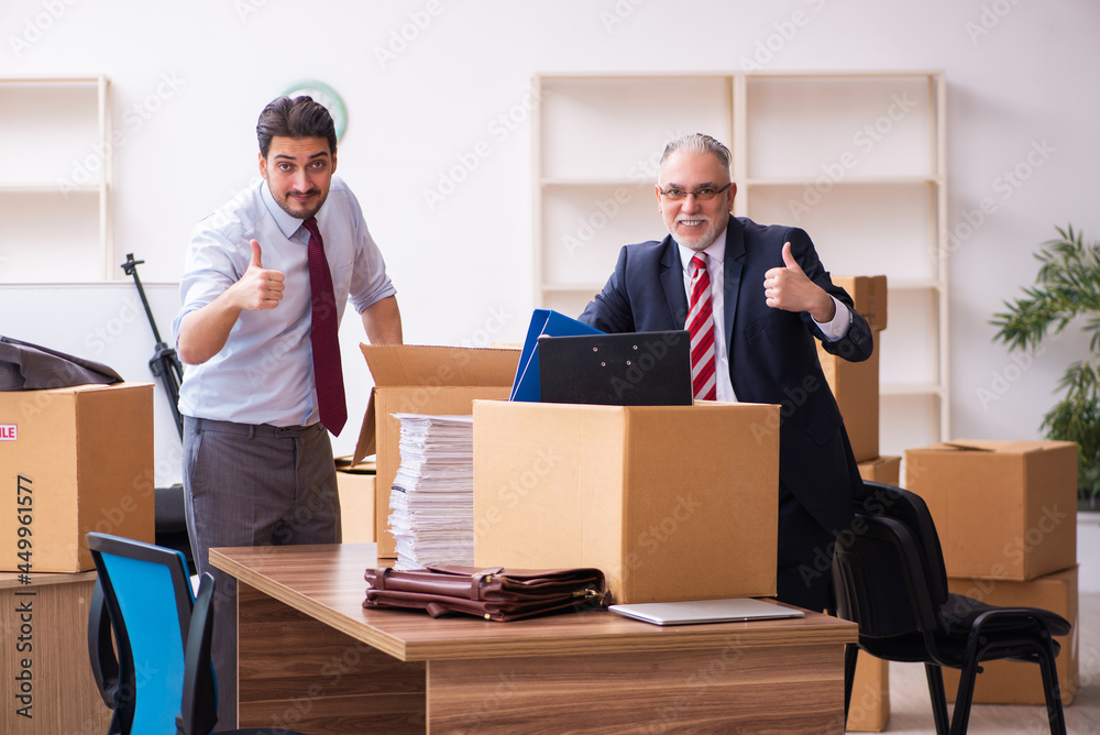 Two male employees in relocation concept Two male employees in relocation concept