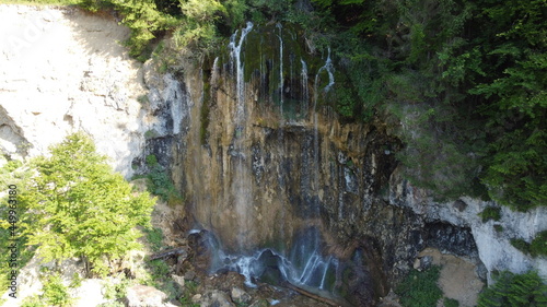 Waterfall in the national park. Waterfall full of mosses. Waterfall Pisoaia photo