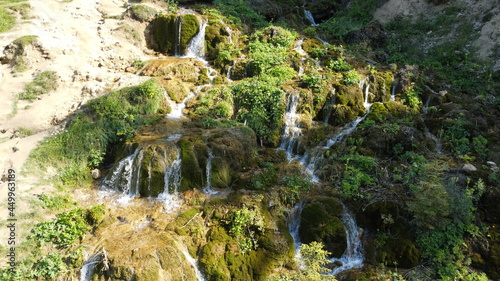 Waterfall in the national park. Waterfall full of mosses. Waterfall Pisoaia photo