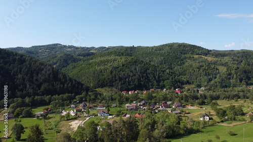 Panorama with hills  forest and village.