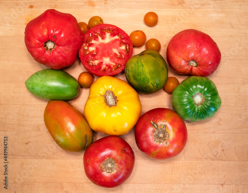 View from above of home grown tomatoes on a wooden surface