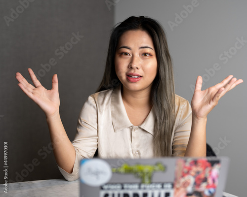 Young Edgy Asian Female Data Scientist Explaining The Scope of a Marketing Analytics Results