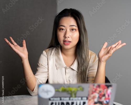 Young Edgy Asian Female Data Scientist Explaining The Scope of a Marketing Analytics Results