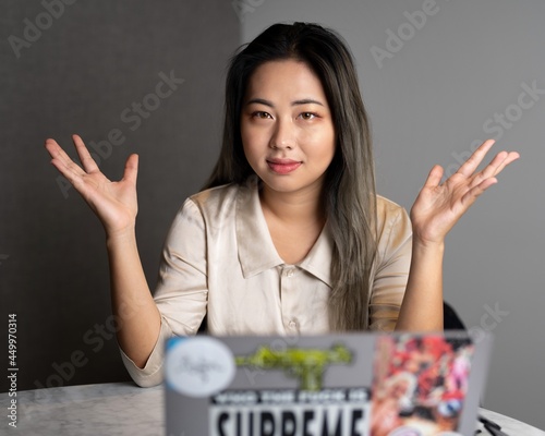 Young Edgy Asian Female Data Scientist Explaining The Scope of a Marketing Analytics Results