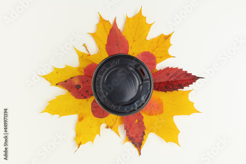 autumn background with coffee cup and leaves