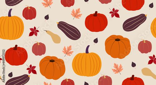 Autumn seamless pattern. Vector illustration in flat design Many cute pumpkins and falling autumn leaves on beige background