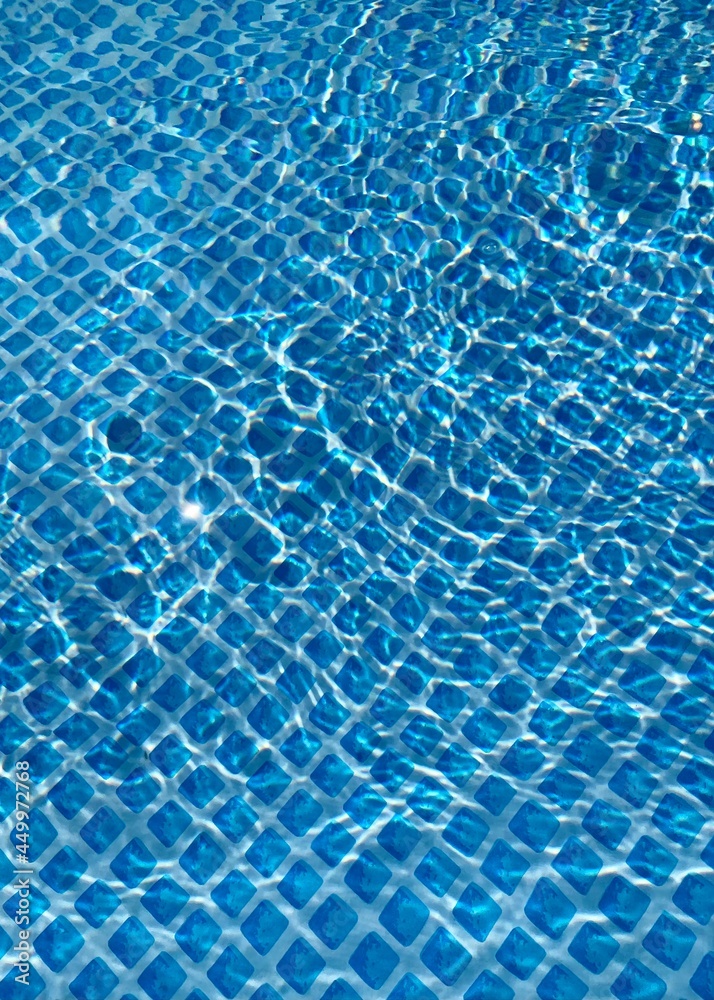 Shimmering blue water mosaic pool background Shimmering blue water mosaic pool background