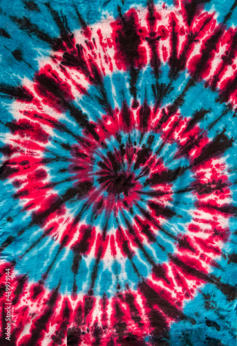 Fashionable Colorful Red  Blue and Black Retro Abstract Psychedelic Tie Dye Swirl Design on cotton shirt. 