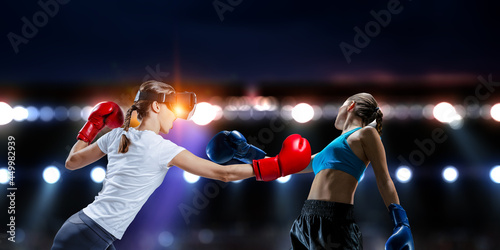 Young woman boxing. © Sergey Nivens