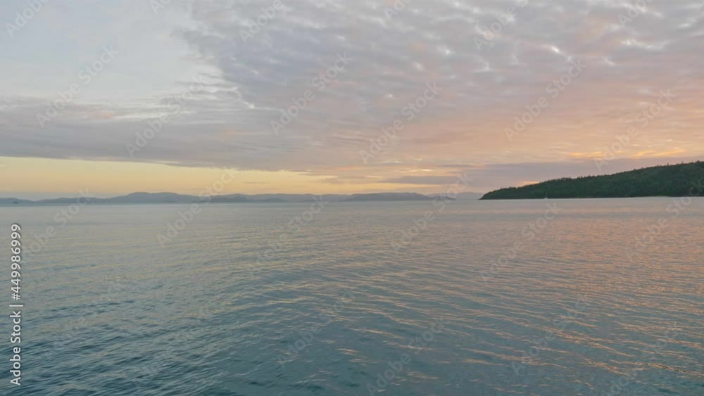 Seascape Under Beautiful Sunset Sky In Hook Island, Whitsundays, Queensland, Australia. wide shot Seascape Under Beautiful Sunset Sky In Hook Island, Whitsundays, Queensland, Australia. wide shot