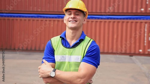 Portrait of professional heavy industry engineer. Technician engineer wearing safety uniform and safety helmet and smile. Large industrial factory background.	