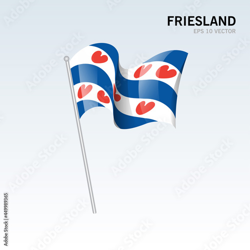 Waving flag of Friesland provinces of Netherlands isolated on gray background
