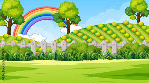 Nature park scene background with rainbow in the sky