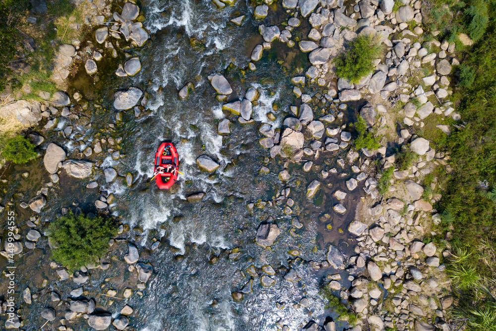 Aerial view, Sportman team are rafting on the river turbulent flow. Extreme and enjoyment sport. Aerial view, Sportman team are rafting on the river turbulent flow. Extreme and enjoyment sport.